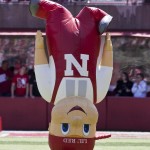 Nebraska mascot Lil' Red bounces on his head prior to the annual Red-White spring college football game, in Lincoln, Neb., Saturday, April 17, 2010. The Red team beat the White team 21-16.(AP Photo/Nati Harnik) ORG XMIT: NENH101