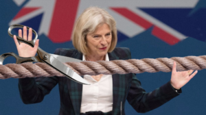 Theresa May, Prime Minister of the United Kingdom, cuts the rope connecting the UK to the rest of Europe. Nolan Cooney | The DailyER