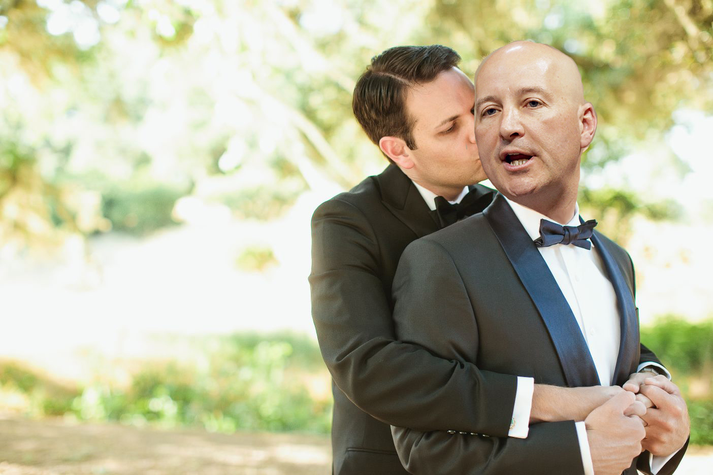 Pete Ricketts and boyfriend Steve Kandor pose embracing each other.